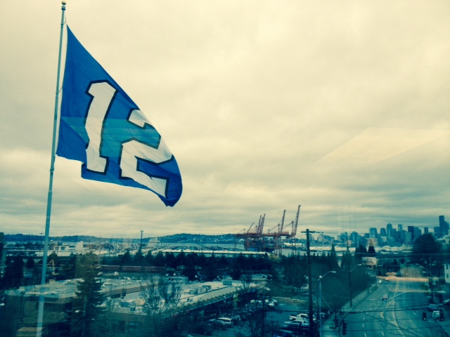seattle waterfront 12th man flag cloudy