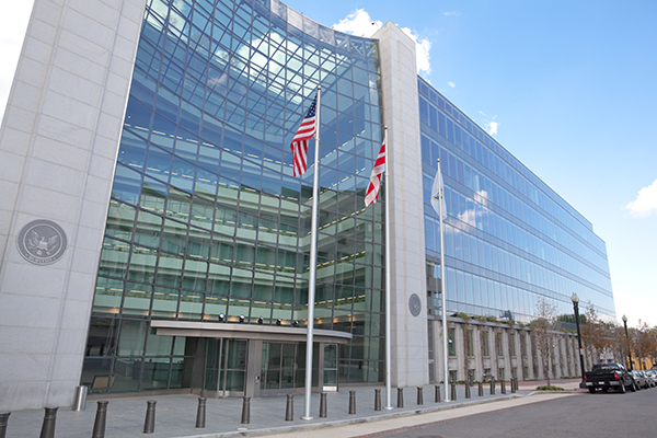 commercial building, glass windows, security exchange commission flags