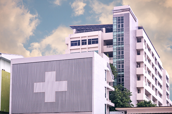 hospital insignia multi-story building partly cloudy